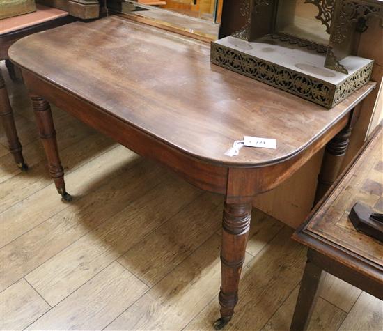 A pair of Regency mahogany D shaped dining table ends, with ring turned legs and fitted brass castors W.113cm